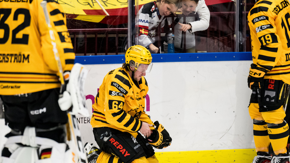 Jonathan Pudas grimaces after being hit in the head.