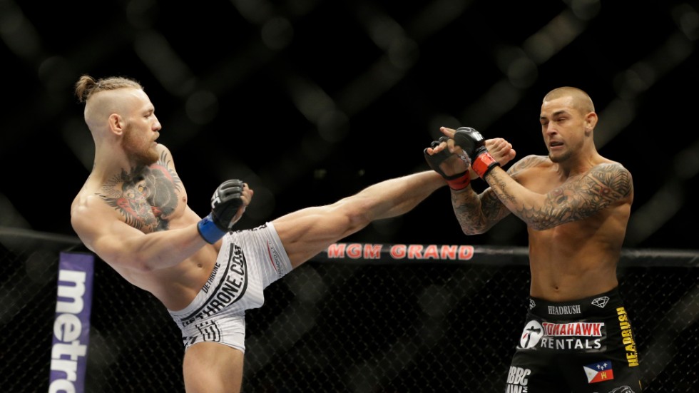Conor McGregor och Dustin Poirier vid förra mötet i september 2014. Arkivbild